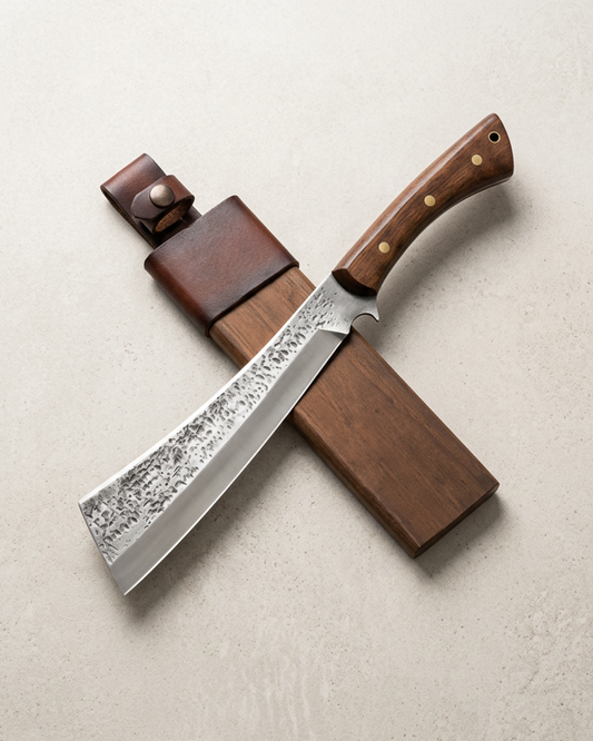 A Japanese-style chef's knife with a patterned steel blade and a brown wooden handle, shown crossed over a matching dark brown wooden and leather case on a light beige textured background.